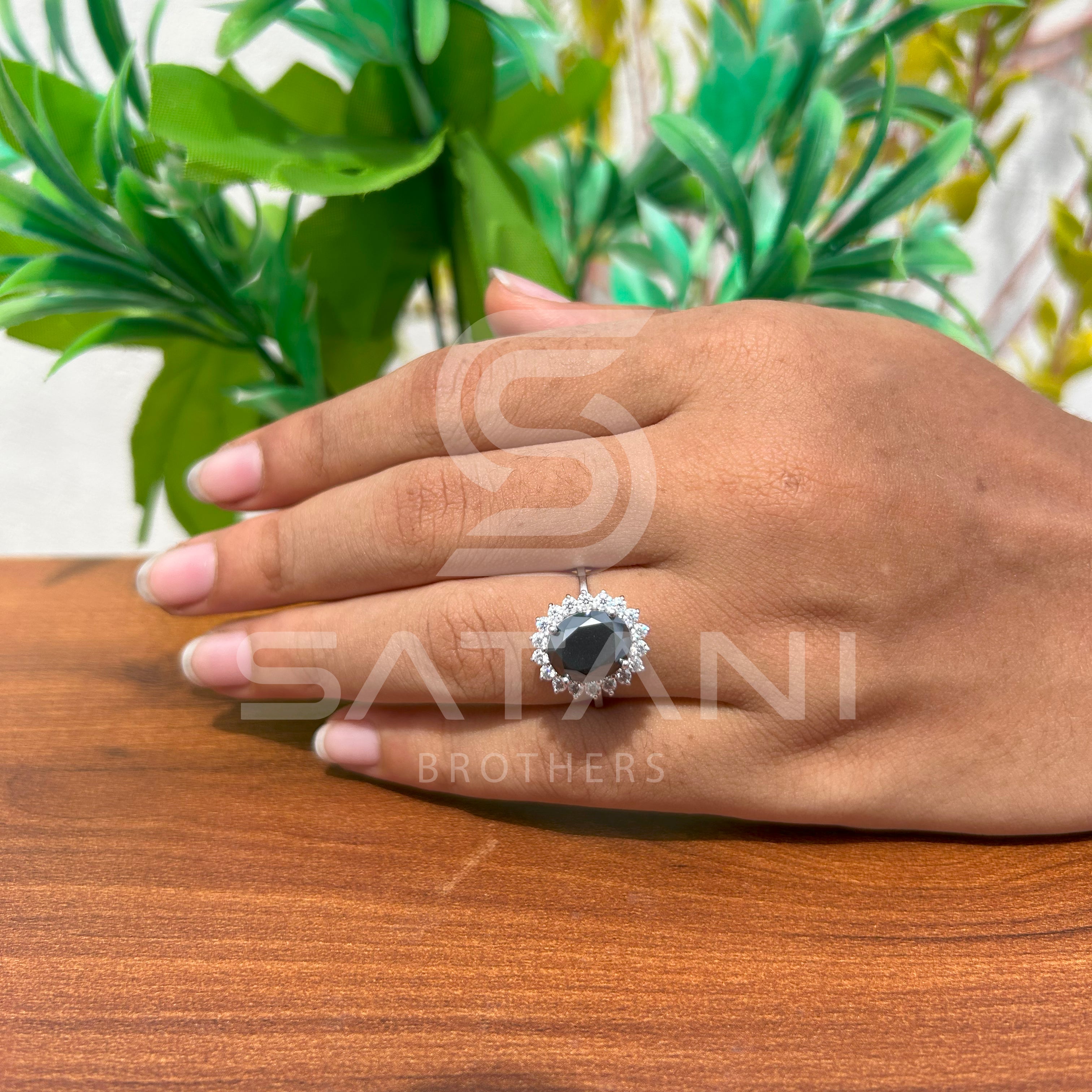"Oval Black Diamond Halo Ring in White Gold"
