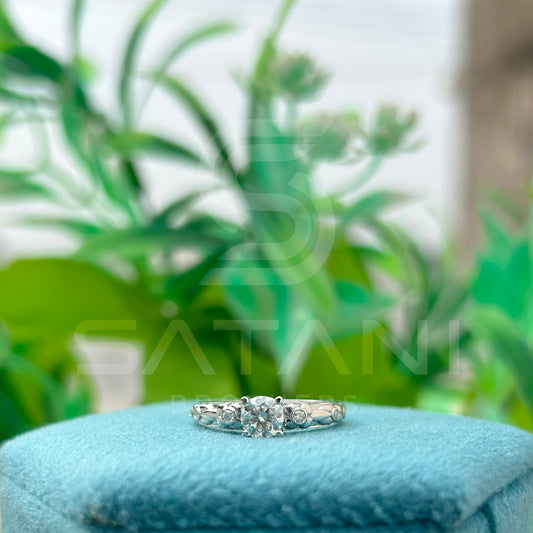 "Round Cut Solitaire Ring with Side Accents – Elegant Engagement Design"