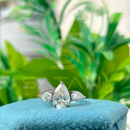 “Pear Shape Diamond Three Stone Engagement Ring with Oval Side Stones”