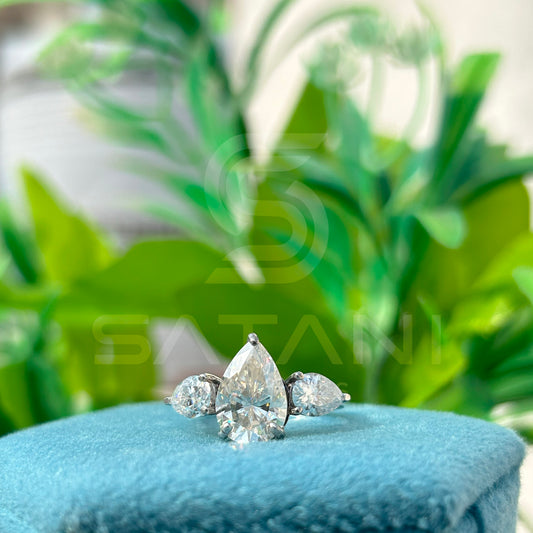 “Pear Shape Diamond Three Stone Engagement Ring with Oval Side Stones”