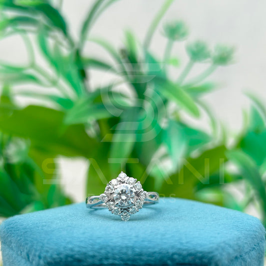 Round Brilliant Cut Diamond Floral Halo Engagement Ring in White Gold