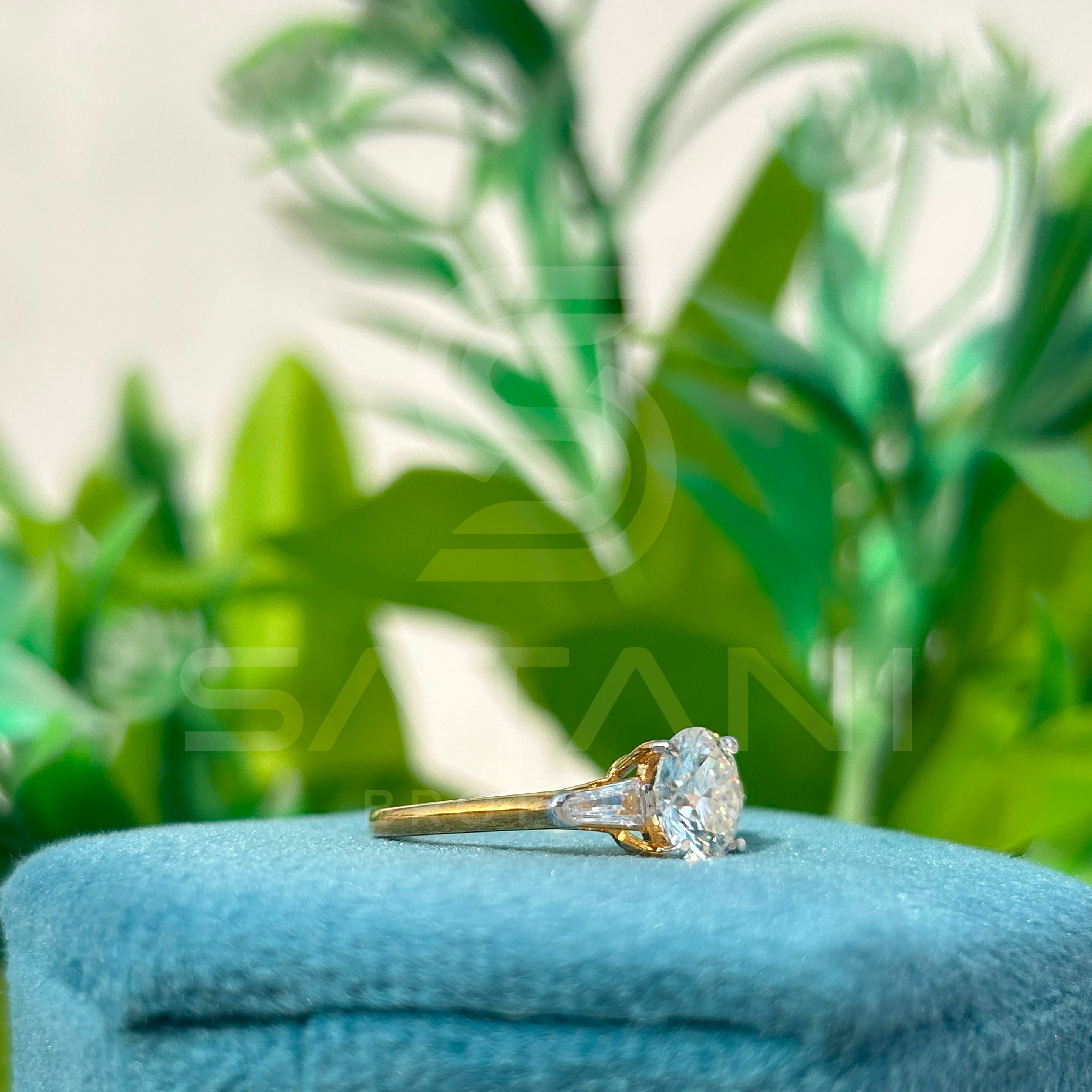Round Brilliant Cut Diamond Engagement Ring with Baguette Side Stones