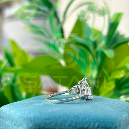 “Pear Shape Diamond Three Stone Engagement Ring with Oval Side Stones”