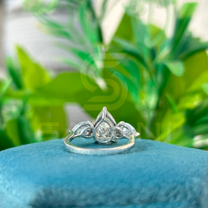 “Pear Shape Diamond Three Stone Engagement Ring with Oval Side Stones”