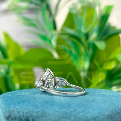 “Pear Shape Diamond Three Stone Engagement Ring with Oval Side Stones”