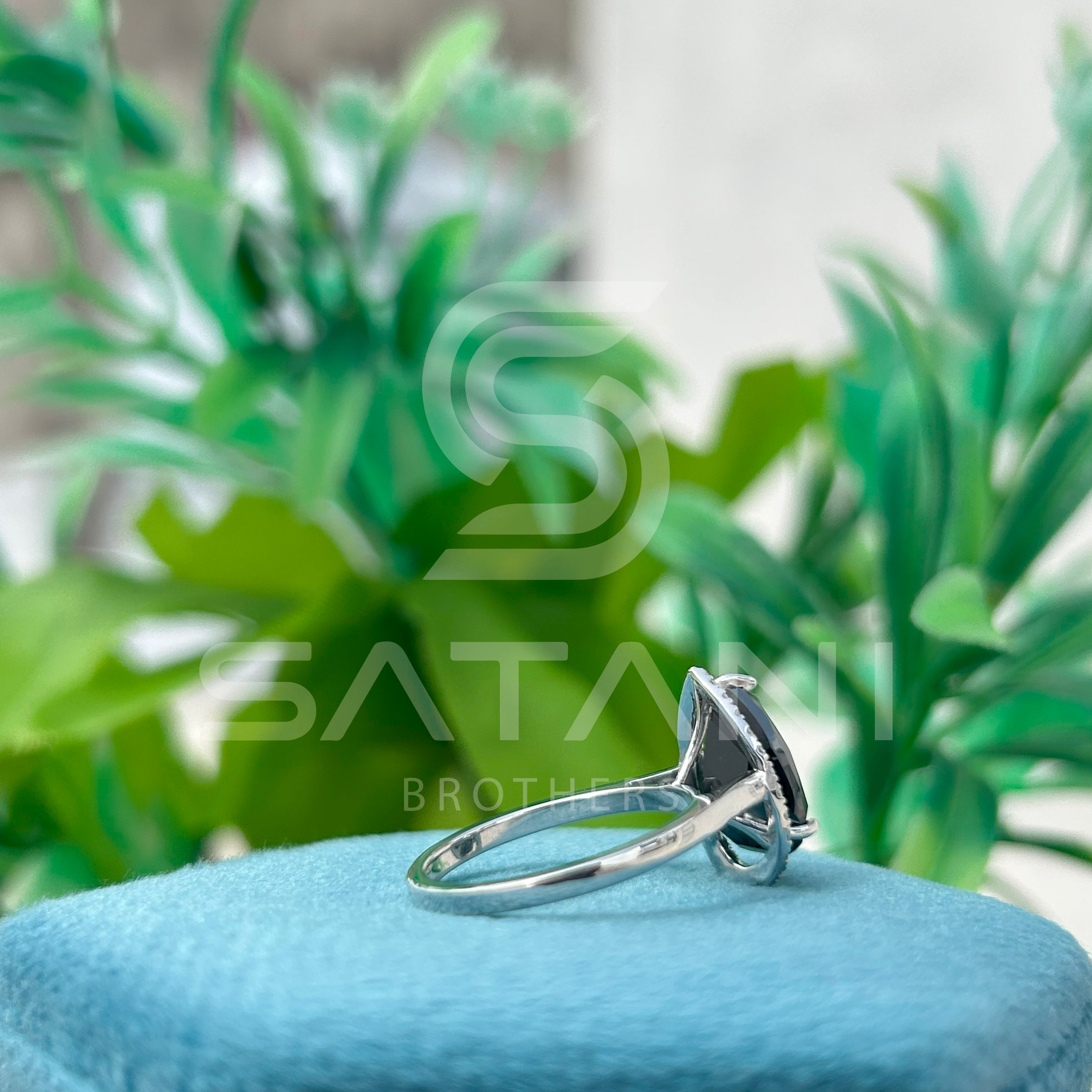 “Pear Shape Black Diamond Halo Engagement Ring in White Gold”