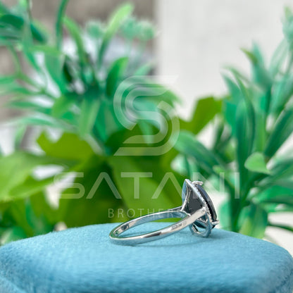 “Pear Shape Black Diamond Halo Engagement Ring in White Gold”
