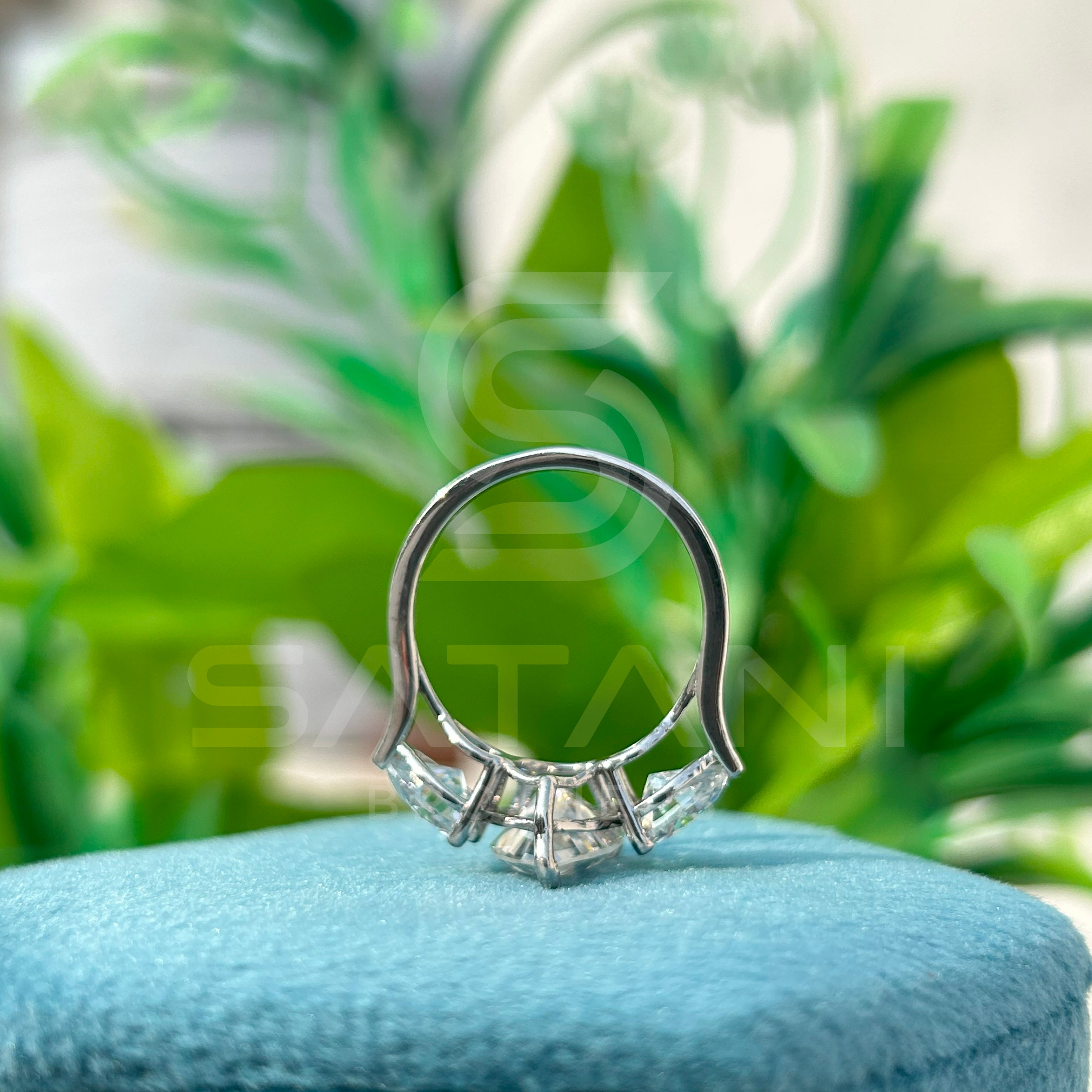 “Pear Shape Diamond Three Stone Engagement Ring with Oval Side Stones”