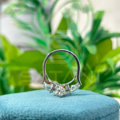 “Pear Shape Diamond Three Stone Engagement Ring with Oval Side Stones”