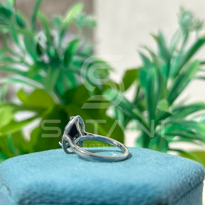 “Pear Shape Black Diamond Halo Engagement Ring in White Gold”