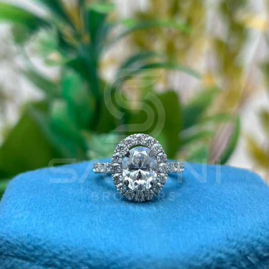 "Oval Cut Diamond Halo Engagement Ring in White Gold – Classic Oval Solitaire with Pave Band"
